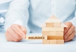 house made of blocks with the last one going in labeled insurance