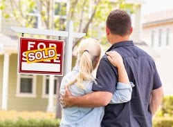 Standing in front of sold home