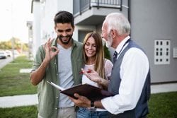 real estate agent meeting with a couple